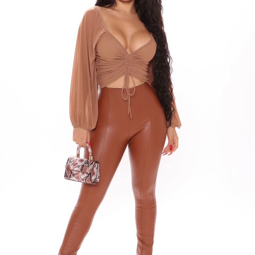 Stylish top-only worn once. Versatile and can worn on or off shoulders
